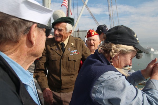 From left: Veterans Lou Berg, George Coles, Orlo Mellon and Dee Davison smile after tossing a memorial wreath from the deck of the SS Red Oak Victory during the Veteran’s Day celebration at the Port of Richmond. (Photo by: Kevin N. Hume)